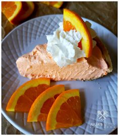 orange slices and whipped cream on a white plate