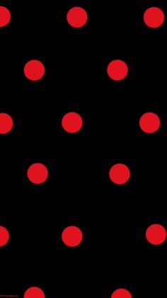 a black background with red polka dots