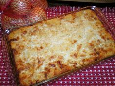 a casserole dish is sitting on a red and white checkered tablecloth