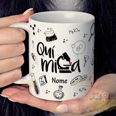 a woman holding a coffee mug with the words ou mica on it