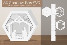 paper cut out of the nativity scene with an ornament, star and manger