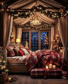 a bedroom decorated for christmas with plaid blankets and lights on the windowsill, candles lit up in front of the bed