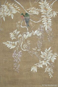 two birds sitting on a tree branch in front of a wallpaper with white flowers