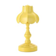 a yellow table lamp on a white background