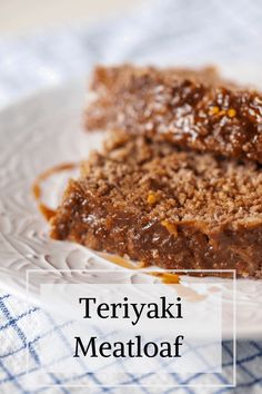 two slices of meatloaf on a plate with the words teriyaki meatloaf