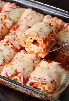 a glass casserole dish filled with lasagna rolls