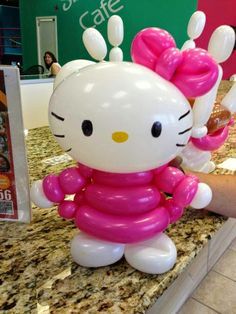 a hello kitty balloon sitting on top of a counter