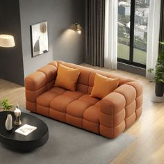 a living room filled with furniture next to a large window and a plant on top of a table