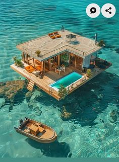 an aerial view of a house on stilts in the water with a boat nearby