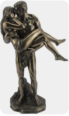 a bronze statue of a man holding a woman