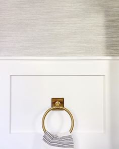 a towel ring is hanging on the wall