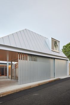 a white building that is next to a street