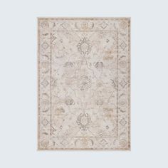 a beige rug with an intricate design