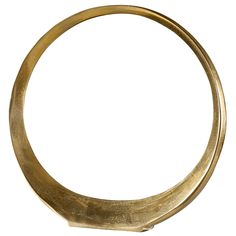 a gold colored metal ring on a white background