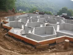 a construction site with concrete blocks laid out on the ground