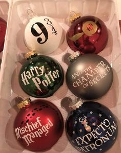 six harry potter christmas ornaments in a white box with the words harry potter printed on them