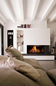 a living room filled with furniture and a fire place