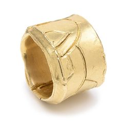 a gold ring on a white background