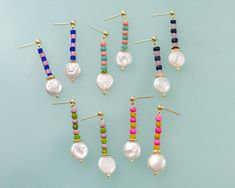 Colorful Seed Bead and Pearl Earrings Choose from 5 different colors using the drop-down menu. If you prefer mix-matched pairs, please leave a note in the order's note section. DETAILS: - 4mm sterling silver ball post - Earrings are approximately 1.5 inches long *Please note that bead colors may vary slightly from the photo. Handcraft Earrings, Fern Earrings, Coin Pearl Earrings, Handmade Jewlery, Bead Charms Diy, Pearl Dangle Earrings, Coin Pearls, Pearl Earring, Minimal Jewelry