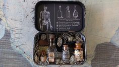 an open suitcase filled with bottles and skeleton figurines on top of a map