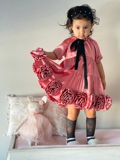 Petite Maison Kids. Made in Turkey. A beautiful and couture silky satin dress. Tiered skirt and large handmade roses on the hem. Black satin necktie. Side zipper closure. Cotton lining. Composition: 92% Polyester, 5% Silk 3% Lycra. Silky Satin Dress, Large Roses, Satin Roses, Mauve Color, Rose Dress, Tier Skirt, Satin Dress, Tiered Skirt, Signature Design