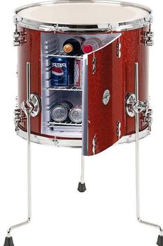 a red and silver drum case with an open door on the side that has drinks in it