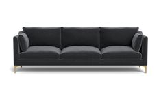 a gray couch with gold legs on a white background