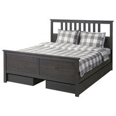 a bed with two drawers underneath it and a checkered comforter on the bottom