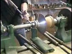 a man working on machinery in a factory