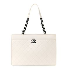 This is an authentic CHANEL Caviar Quilted My Everything Large Shopping Tote in White and Black. This edgy shoulder bag is crafted of luxurious calfskin leather with signature diamond-shaped quilting in white. It features leather threaded black chain shoulder straps with leather shoulder pads and a black Chanel CC logo on the front. The top opens to a black fabric interior with a zipper pocket. High-end Quilted Shoulder Bag For Everyday Luxury, Designer Rectangular Bag With Diamond Quilting, Designer Formal Bags With Diamond Quilting, Designer Diamond Quilted Formal Bags, Designer Leather Shoulder Bag With Diamond Quilting, Chic Top Handle Bag With Diamond Quilting, Luxury Evening Bag With Diamond Quilting, Elegant Leather Shoulder Bag With Diamond Quilting, Elegant Leather Bags With Diamond Quilting