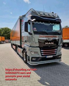 a large semi truck parked in a parking lot