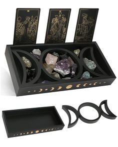 a black box with rocks and cards in it