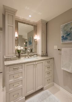 a large bathroom with two sinks and mirrors