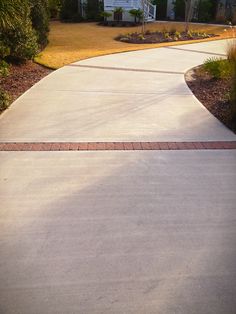 a man riding a skateboard down a sidewalk