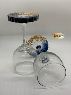 two wine glasses sitting next to each other