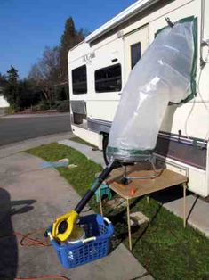 an rv is parked on the side of the road with a plastic bag attached to it