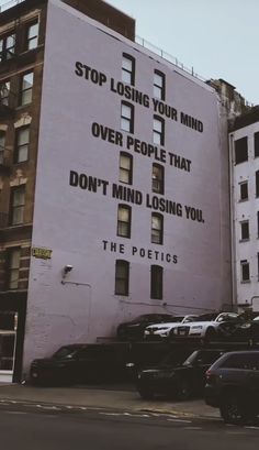 an advertisement on the side of a building that says stop losing your mind over people that don't mind losing you