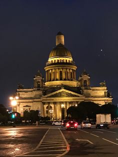 a large building with a dome at night