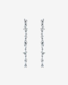 Add a touch of glamour to your ensemble with our Classic Diamond Sparkler Drop Earrings. Expertly handcrafted in 18-karat gold, these exquisite drop earrings are the perfect blend of sophistication and sparkle. Set with a mix of baguette and round white diamonds in our timeless 'Fireworks' design, they are sure to elevate any outfit, making every moment and every look unforgettable. Details 18k yellow gold, rose gold or white gold 0.22 carats of baguette white diamonds 0.20 carats of round white Evening Baguette Diamond Dangle Earrings, Evening Dangle Earrings With Baguette Diamonds, White Gold Baguette Diamond Earrings For Evening, White Gold Dangle Earrings With Baguette Diamonds, White Gold Earrings With Baguette Diamonds For Party, Bridal Diamond Drop Earrings With Baguette Diamonds, Dangle Earrings In White Gold With Baguette Diamonds, Bridal Drop Earrings With Baguette Diamonds, Fine Jewelry Baguette Diamond Drop Earrings