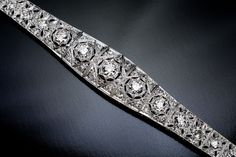 Early Art Deco, c. 1910s This very well made star motif platinum openwork bracelet is embellished with bright white old European and old mine cut diamonds (G-H color, SI1-SI2 clarity). Estimated total diamond weight is 3.70 carats. Length - 179 mm (7 in.) Width at the widest point - 14 mm (9/16 in.) Weight 23.22 grams Formal Rose Cut Diamond Bracelets, Formal Bracelets With Rose Cut Diamonds, Formal Diamond Bracelet With Rose Cut Diamonds, Elegant Silver Diamond Bracelet With Rose Cut, Classic Rose Cut Diamond Bracelet, Classic Diamond Bracelet With Rose Cut Diamonds, Classic Rose Cut Diamond Bracelets For Formal Occasions, Luxury Silver Diamond Bracelet With Rose Cut Diamonds, Victorian Diamond Bracelet For Anniversary