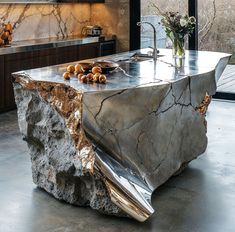 a kitchen island made out of large rocks