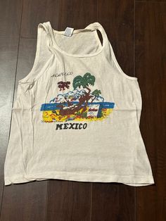 Vintage 1960s/70s Acapulco Drinking Donkey Mexico Graphic Tank Top T Shirt USA size fits XS measures 17x21 inches Cotton Tops With Retro Print For The Beach, Cotton Retro Print Top For Vacation, Retro Cotton Tops With Vintage Print, Vintage Cotton Tops With Retro Print, Retro Screen Print Tops For Beach, Beach Retro Print Tops, Cotton Retro Print Vacation Top, Casual Cotton Tops With Retro Print, Vintage Screen Print Tops For Vacation