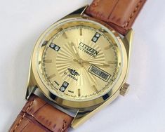 Vintage Citizen Eagle 7 Automatic Japan Mens Wrist watch gold dial mechanical 21J day date gold plated gift for men for him This restored vintage watch has undergone professional cleaning, polishing, servicing, and oiling and is now ready to use  . Watch case diameter is 35mm without the crown and the lug size is 18mm . The watch features a new aftermarket dial, hands and band/strap, while retaining its original case and movement. . Provided pictures are an integral part of the item description, 1980s Bands, Steel Gifts, Wristwatch Men, Watch Case, Wrist Watches, Gift For Men, Vintage Watches, Silver Watch, Gold Watch