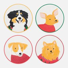 four coasters with dogs painted on them in different colors and sizes, each featuring a dog wearing a sweater