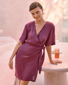 Our take on a classic linen wrap dress is refreshingly modern with stylized sleeves, casual shoulders, and lining in all the right places for coverage. An effortlessly feminine seasonal staple for workdays, weekends, special events, and vacations. Exclusive. V-neckline. Slight drop shoulders. Elbow-length sleeves with fixed rolled cuffs. Asymmetrical wrap front with tie closure. Partially lined. Homebody Essentials, Linen Dress Wedding Guest, Women Cocktail Attire, Purple Linen Dress, Thanksgiving Play, Elegant Wrap Dress, Bohemian Outfits, Summer Wrap Dress, Wrap Tunic