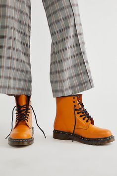 **Fit Note:** If in between whole sizes, we recommend sizing down.The original Dr. Martens 8-eye boot updated in a smooth leather, featuring their iconic rubber air-cushioned sole and yellow stitching.* Grooved sides* Goodyear Welt design, upper and sole are sewn together* Slip resistant Orange Fits, Goodyear Welt, Dr. Martens Boots, Boho Clothing, Lace Up Boots, Boho Outfits, Smooth Leather, Color Coding, Combat Boots