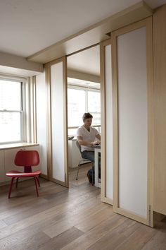 a man sitting at a desk in an office