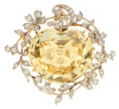 A Belle Époque Yellow Sapphire and Diamond Brooch/Pendant, J.E. Caldwell, circa 1900: Heart-shaped mixed-cut sapphire measuring approximately 23.5 x 20.9 x 11.3mm; signed J.E.C. & Co., ref. no. D7551; estimated total diamond weight: 1.20 carats; mounted in platinum-topped 18k gold; length: 1 1/2in. Edwardian Jewelry, Vintage Jewels, Mellow Yellow, Yellow Sapphire, Belle Epoque, Yellow Diamond, Antique Jewellery