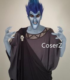 a man with blue hair wearing a costume