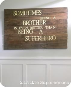 a wooden sign that says sometimes being a brother is even better than being a superhero